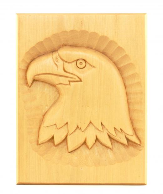 An eagle carved into balsa wood.