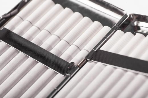 Light cigarettes have white filters, while regular cigarettes have tan filters.