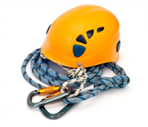 Ropes and helmets are essentials used in mountain climbing.