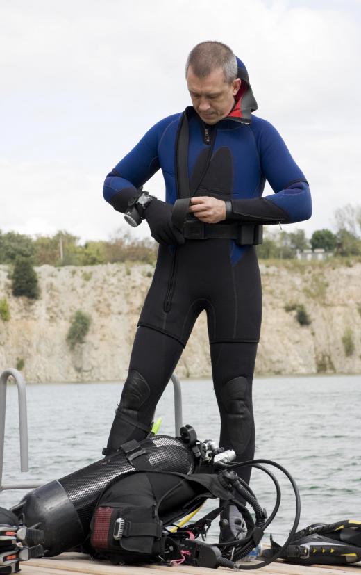 Equipment that can aid in navigation, such as prismatic compasses, can be worn over wetsuits.