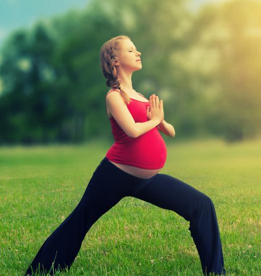 Gentle yoga can help ease the back pain of pregnant women.